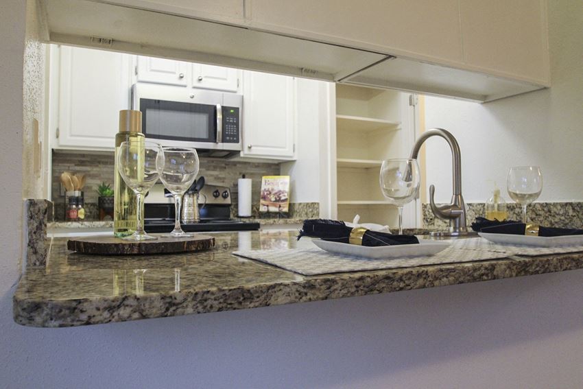 This is a photo of the kitchen of a 1245 square foot 2 bedroom apartment at Cambridge Court Apartments. - Photo Gallery 1